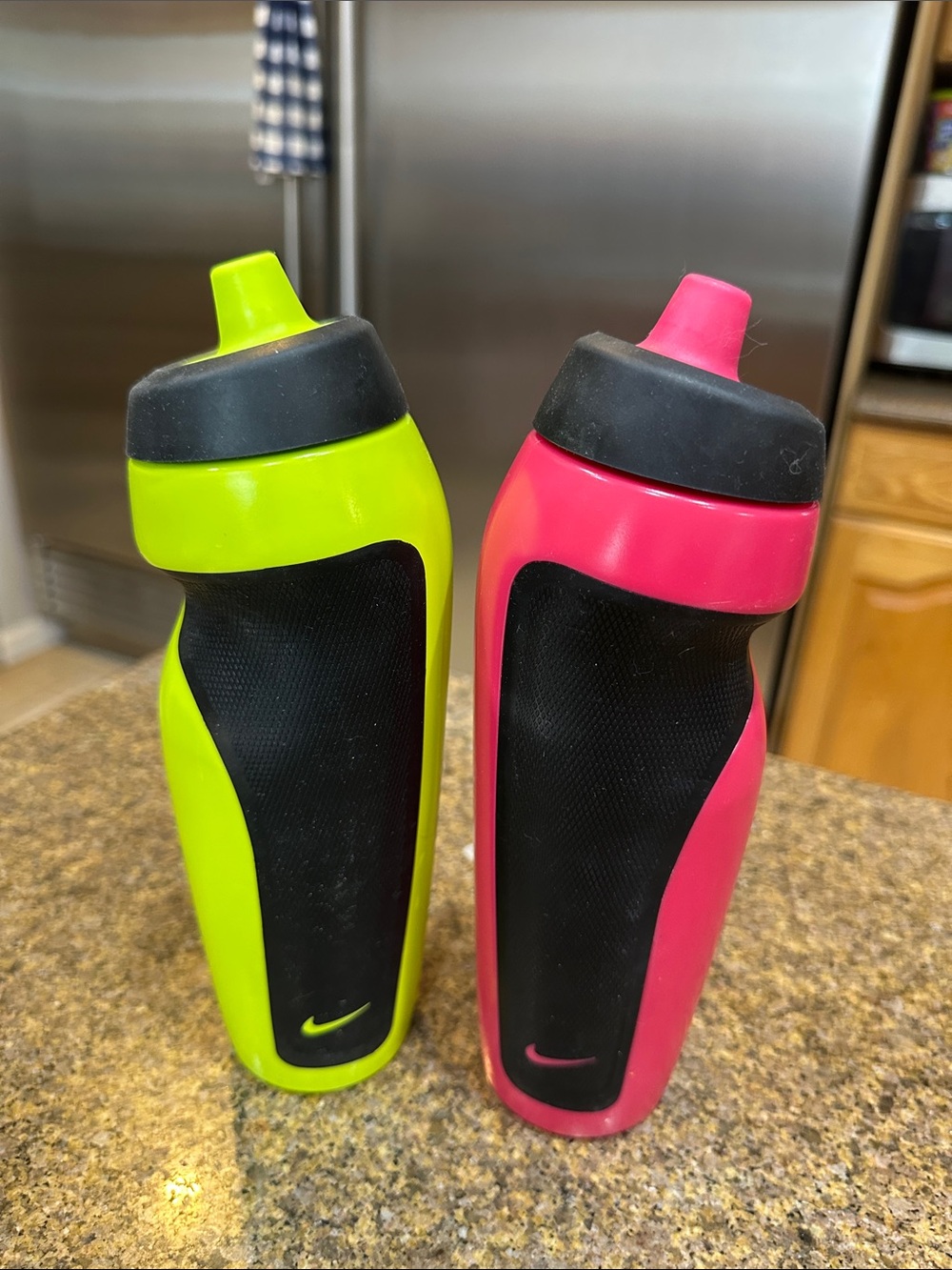 Nike Neon Green and Neon Pink Dual Grip Sports Sipper Bottles.